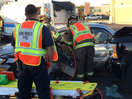 A female was extracted from her vehicle following a crash on Sunset Dr. Thursday, Oct. 2 2014. (LIVE! Photo/John Basquez)