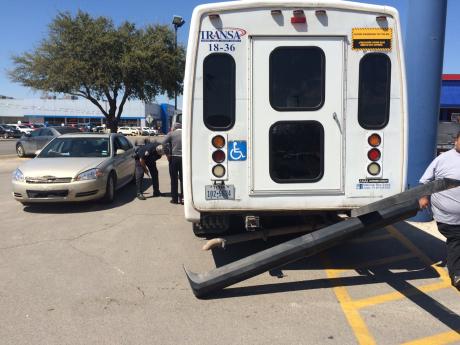 A Chevy Impala crashed into a TRANSA bus while leaving Burger King on March 25, 2015. (LIVE! Photo/John Basquez)