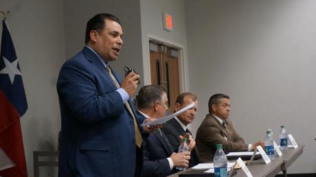 Tim Vasquez (left) speaks at a candidates' forum during his failed re-election bid in 2016