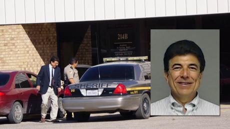 Ray Zapata enters a sheriff&#039;s vehicle before being booked into the county jail; smiles for his mugshot. 