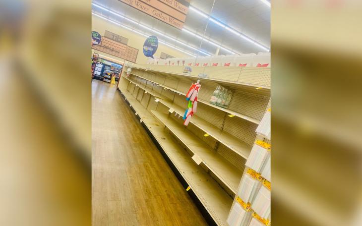 Empty shelves in the bottled water section at Market Street