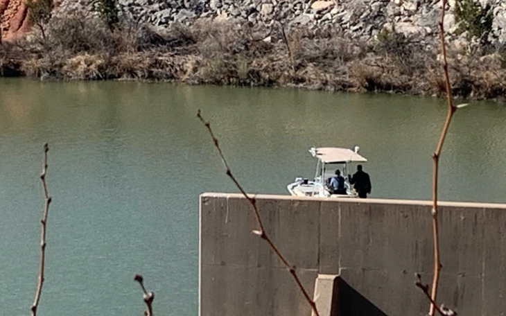 Law Enforcement Searching Spillway