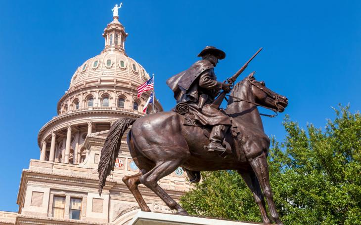 The Texas Capitol behind the Terry's Texas Rangers Monument