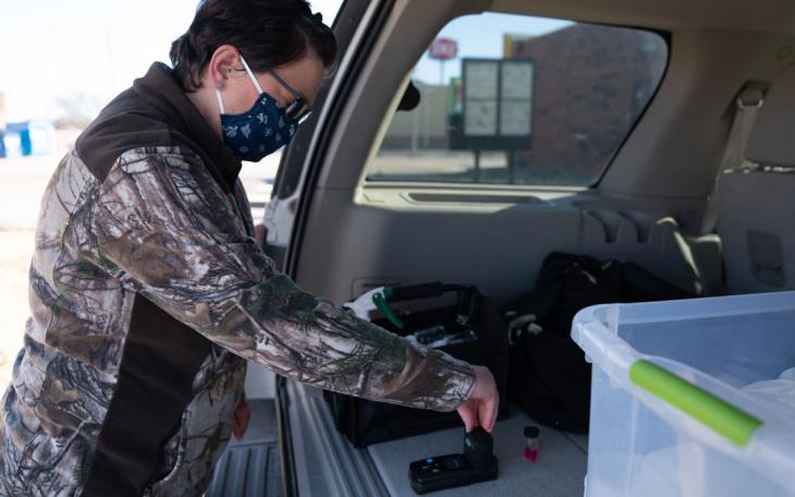 Courtney Lemons from the City of San Angelo Water Quality division collects water samples following winter storm that froze pipes and dropped water pressure on Feb. 22, 2021