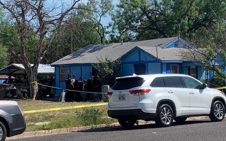 Officials remove a body from the residence in the 600 block of 19th Street