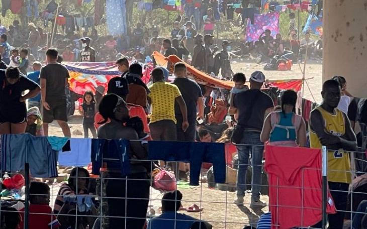 Migrants gathered and camping underneath the Del Rio International Bridge