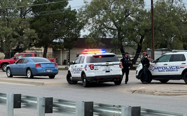 Blue Charger Stopped by Police Outside at the Intersection of the Loop and Glenna