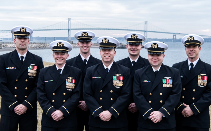 Warrant Officer 1 James Goodyear, Thomas Forsythe, Devin Layser, Matthew Brickley, Jacob Mettlen, Christopher Nolan and Kiel Massong; the first Warrant Officer Aerial Vehicle Operators; assemble at Officer Training Command Newport, (OTCN) Rhode Island, Jan. 25, prior to their graduation from Officer Candidate School (OCS) class 05-22. The class is part of the Navy’s second phasing-in of the Warrant Officer-1 corps. OCS morally, mentally, and physically develops civilians and fleet Sailors into newly commiss