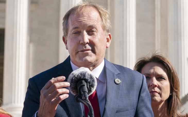 Texas Attorney General Ken Paxton, left, next to his wife and Texas State Sen. Angela Paxton, speaks to anti-abortion activists at a rally outside the Supreme Court, Monday, Nov. 1, 2021, on Capitol Hill in Washington. (AP Photo/Jacquelyn Martin)