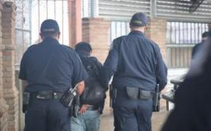 Suspect Escorted by CBP Officers (Contributed/CBP)