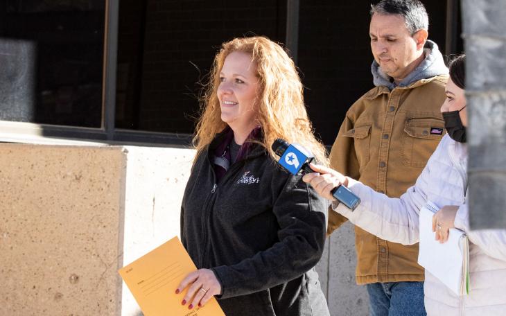 enny Cudd, a flower shop owner and former Midland mayoral candidate, and Eliel Rosa leave the federal courthouse in Midland, Texas.