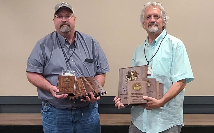 Mark and Paul Sklenarik of Sklenarik's Smoked Meats, Inc. in Miles show off awards won at the 2022 TAMP Convention at Texas A&amp;M University on August 8.