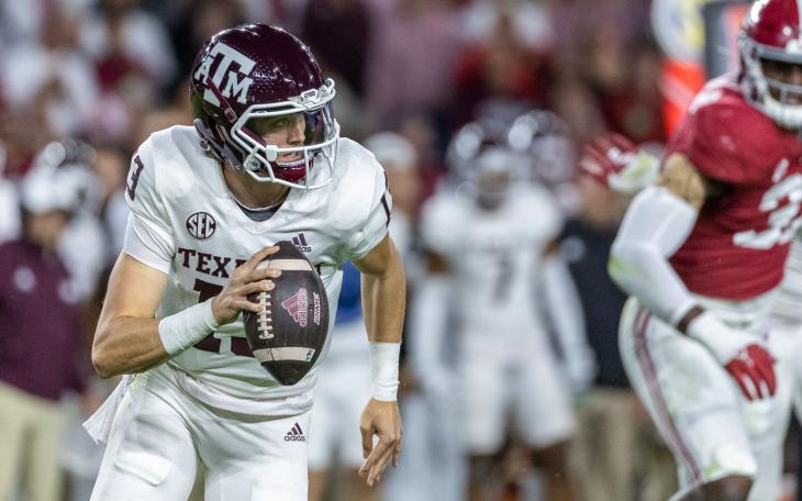 Texas A&amp;M quarterback Haynes King (13) scrambles during the first half of an NCAA college football game against Alabama, Saturday, Oct. 8, 2022, in Tuscaloosa, Ala. (AP Photo/Vasha Hunt)