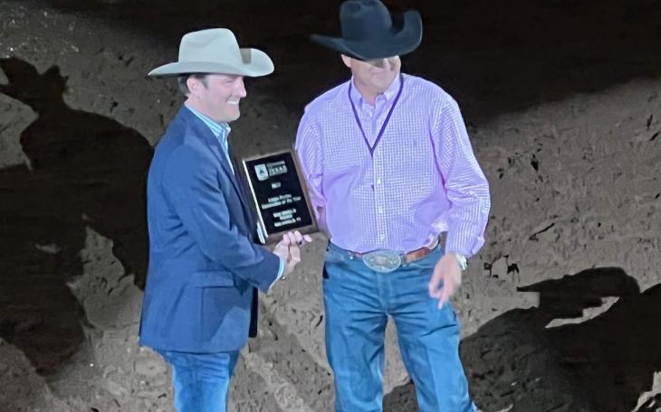 San Angelo Stock Show and Rodeo Assoc. Director Justin Jonas (left) receives the award for &quot;Best Large Rodeo&quot; from the Waco rodeo association president and CEO Wes Allison at the Waco rodeo performance on Oct. 13, 2022.