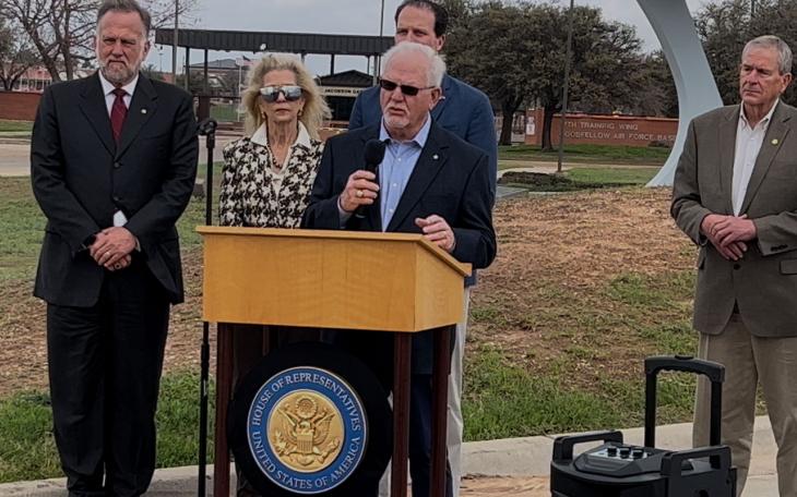 Chamber President Walt Koenig, Mayor Brenda Gunter, Congressman August Pfluger (back), banker Mike Boyd at podium and County Judge Steve Floyd.