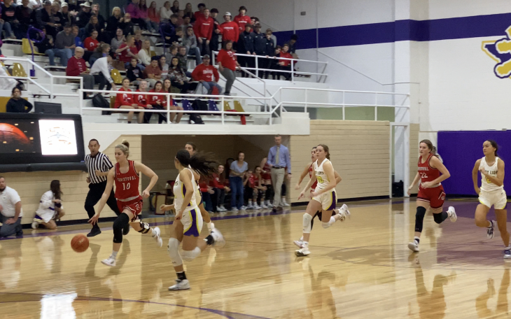 Christoval's Halle Hughes drives toward the basket in the first quarter.