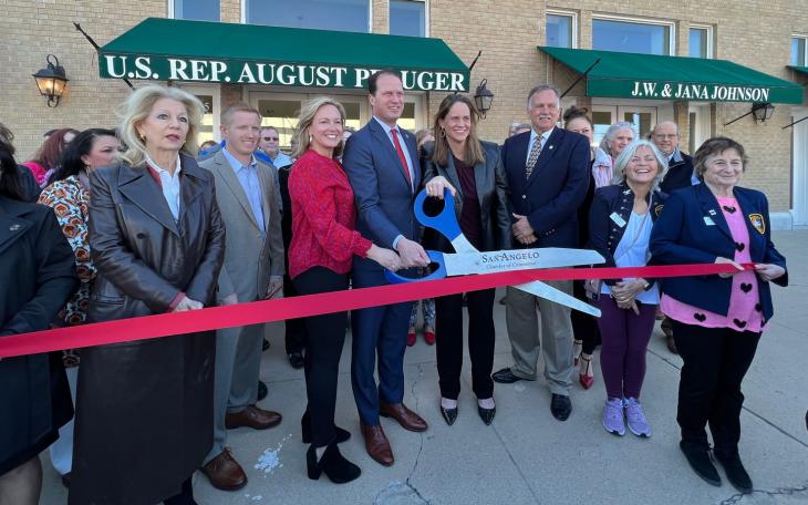 Mayor Brenda Gunter, County Judge Lane Carter, Camille and August Pfluger, Pfluger's Regional Director Karin Kuykendall, and Chamber President Walt Koenig at the ribbon cutting for Pfluger's new office at 124 W. Twohig Ave.