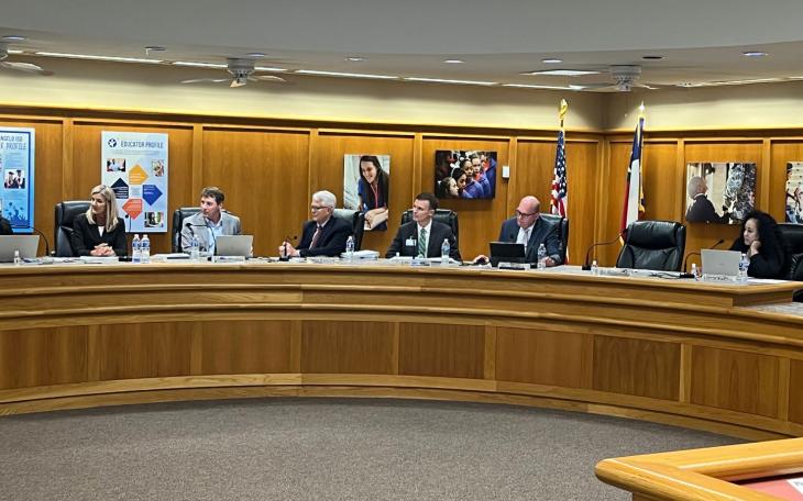 San Angelo ISD Board Trustee Gerard Gallegos pays tribute to outgoing Trustee Max Parker as other board members look on. Parker ended his 18-year service to the San Angelo ISD Board of Trustees on May 15, 2023.