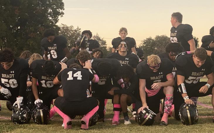 The Brady Bulldogs Pray Before Taking the Field Against the Ballinger Bearcats