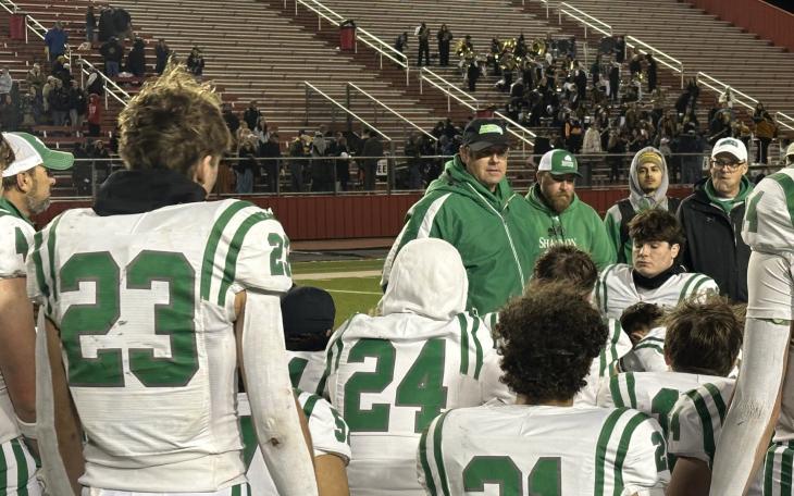 Wall Head Coach Houston Guy talks to his players after loss to Canadian