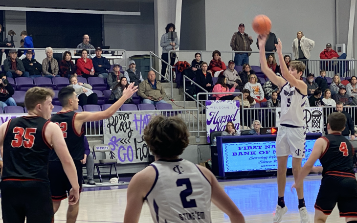 Irion County's Tyler Henderson sinks a three against Garden City
