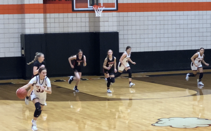 Kailey Freemen drives the ball down the court.