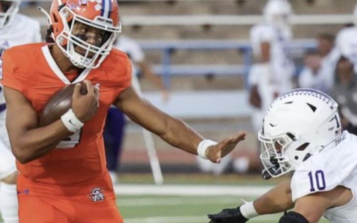 San Angelo Central quarterback Christian English tries to evade a defender in a game against Midland High in 2023.