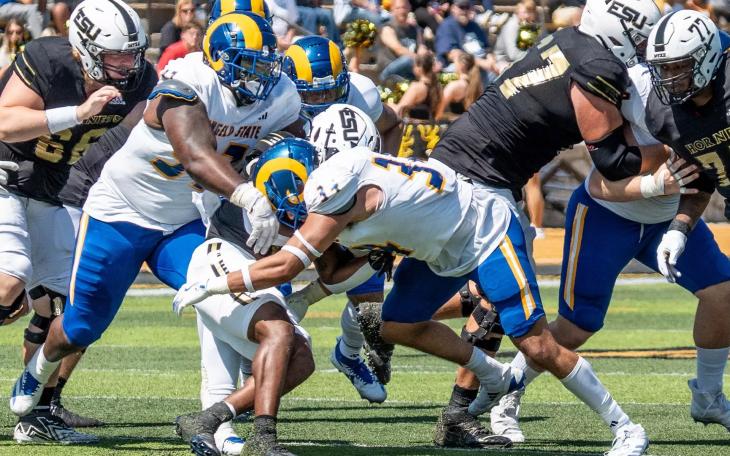 Angelo State's Jeremiah Franks and Dylan Neeley converge on a tackle against Eastern New Mexico on Saturday, Sept. 7, 2024.