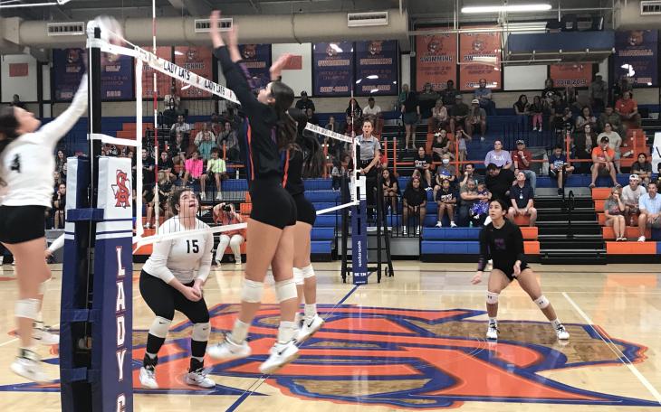 The Central volleyball team goes for a block against Clyde on Tuesday, Sept. 17, 2024.