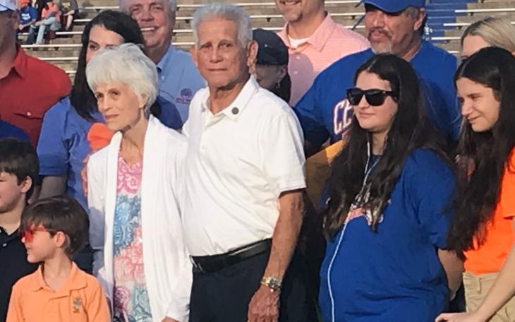 Mr. Manuel Gonzales is with his wife, Amanda, and surrounded by his children and grandchildren for the presentation of his high school diploma.