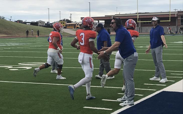 Central head coach Mark Smith encourages his players as they run off the field after a touchdown against Odessa High on Saturday, Nov. 2, 2024.