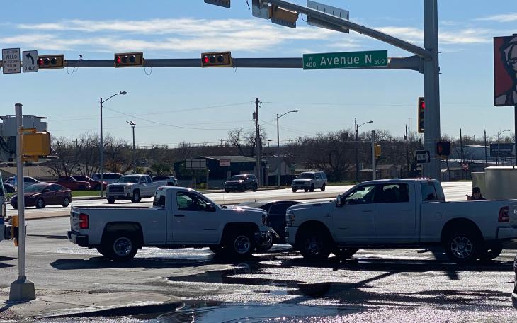 A crash involving two white pickup trucks and a black sedan temporarily closed the intersection of Avenue N and South Bryant Boulevard Sunday morning.