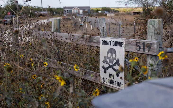 A home across the street from an entrance to an oilfield waste disposal facility has a sign reading &quot;DON'T DUMP ON NORDHEIM&quot; on Sept. 10, 2023. Credit: Julius Shieh/The Texas Tribune
