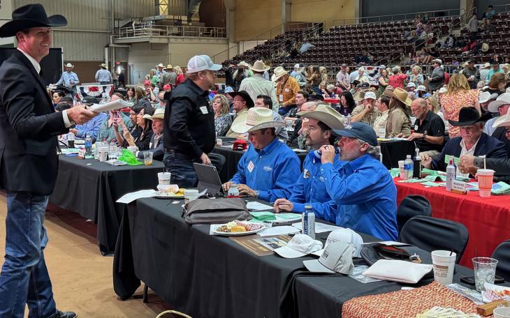 Brett Schniers, a spotter for the Premium Sale Auction, smiles as the gavel comes down.