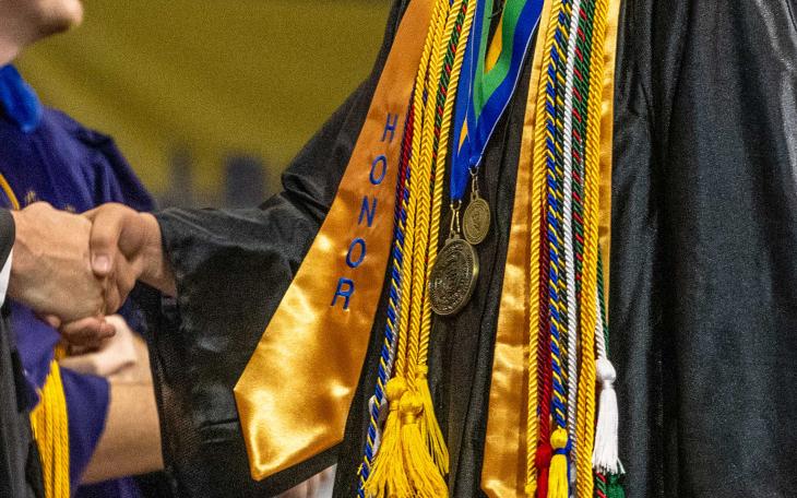 ASU Graduate with Alpha Chi Medal