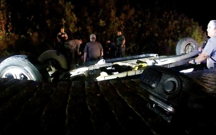 The overturned pickup in the South Llano River with 5 illegal migrants and the human trafficker as first responders attempted to rescue them in Oct. 2022.