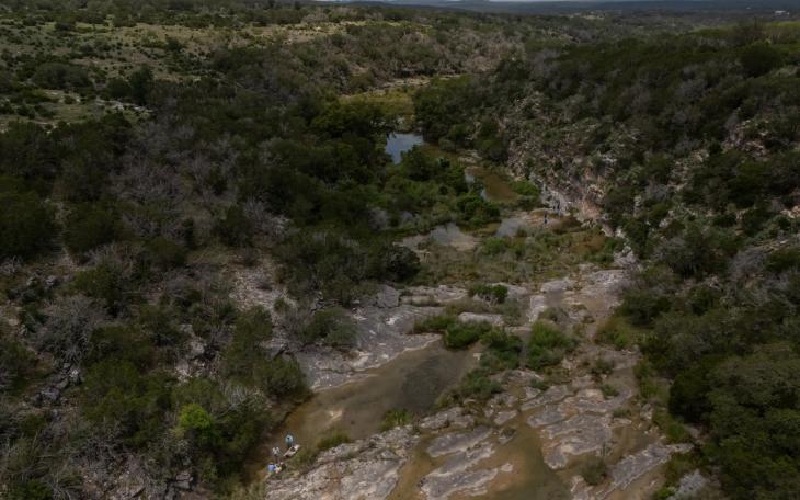 Texas Parks and Wildlife Department biologists and staff take part in an aquatic sampling survey at Yancey Creek, which runs through what will be Post Oak Ridge State Park.