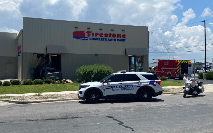 At least two people were taken to the hospital Wednesday afternoon after a car crashed through the Firestone Complete Auto Care building on Knickerbocker Road.