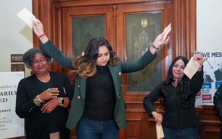 State Rep. Mihaela Plesa, D-Plano, rips up her &quot;permission slip&quot; in front of the Texas House, vowing she will stay the night in the House Chamber in support of fellow Democrat Nicole Collier on August 19, 2025. At left is Rep. Rhetta Bowers, D-Garland, at right is Rep. Cassandra Garcia Hernandez, D-Farmer's Branch.
