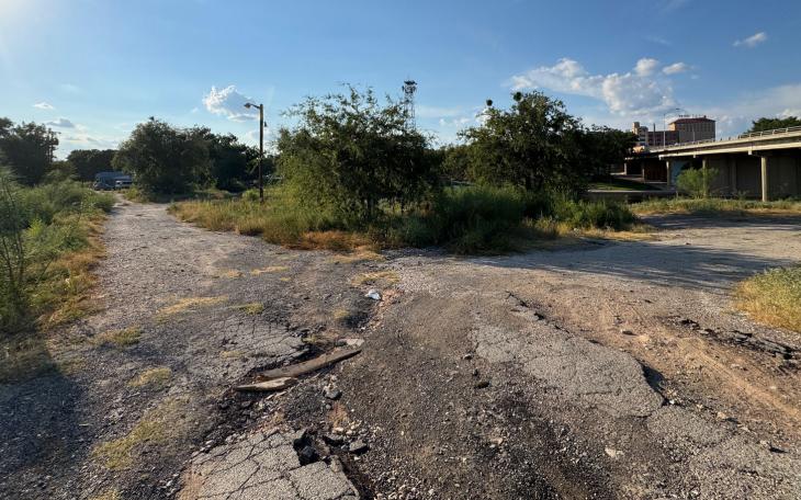 The overgrown site of the former Beaver Lodge Motel at 405 S. Chadbourne St., just south and west of the Chadbourne St. bridge over the Concho River. 