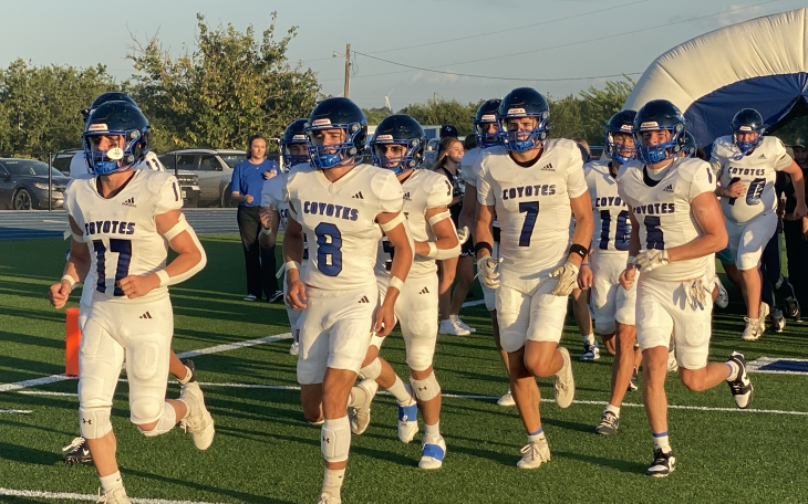 The Richland Springs Coyotes run onto the field before their football game against the Gordon Longhorns on Thursday, Aug. 28, 2025, in Priddy.