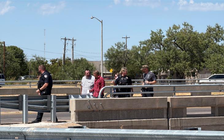 A man threatening to jump from the Main Street overpass onto the Houston Harte Expressway has been talked out of the suicide attempt by police officers.
