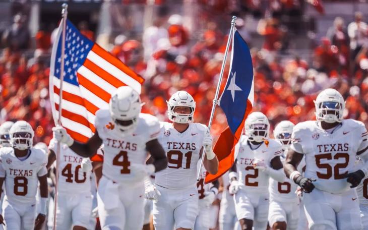The Texas Longhorns football team runs onto the field before a game during the 2025 season.
