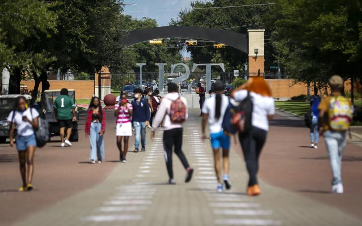 Students walk along the Tiger Walk through campus on the first day of class at Texas Southern University on Monday, Aug. 23, 2021.