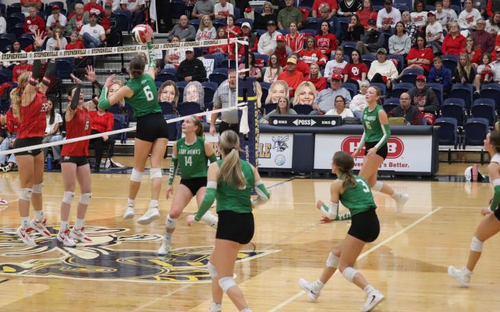 Wall's Peyton Dickson (6) rises up for a kill while Kynlee Stevens (14) looks on during the Lady Hawks' win over Holliday in the regional final.