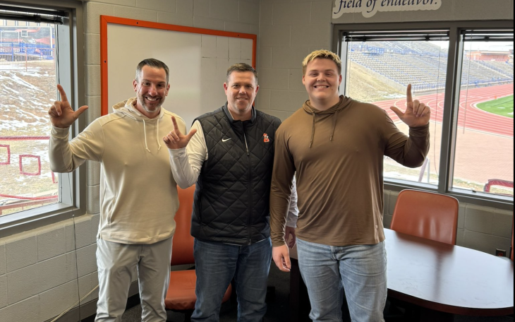 San Angelo Central junior offensive lineman Ethan Boyd is shown with Central head coach Mark Smith (left) and Oklahoma State offensive line coach Cody Crill after receiving an offer to play for Oklahoma State.