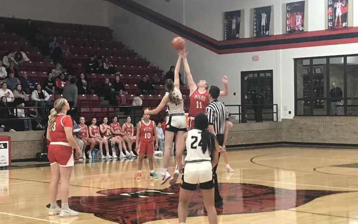 Ballinger's Ysee Le Borgne and Miles' Rylee Vanlenkamp jump for the opening tip Wednesday, Jan. 28, 2026, in Ballinger.