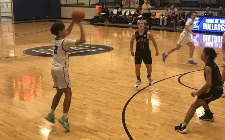 Eden's Avery Condarco knocks down one of his five 3-pointers in the Bulldogs' 50-24 win over Menard on Tuesday, Feb. 3, 2026.