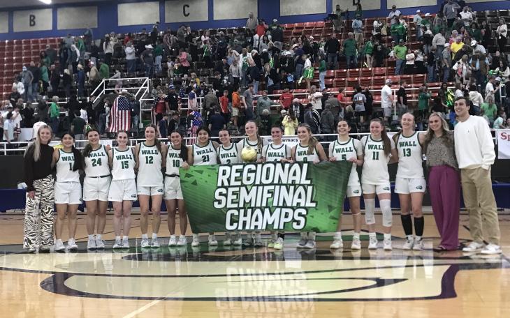The Wall Lady Hawks celebrate after their 35-25 win over Idalou on Tuesday in the regional semifinals in Snyder.