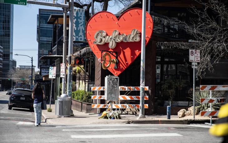 Flowers are left in front of Buford's on West 6th Street in downtown Austin on March 2, 2026. A third victim of a Sunday shooting died Monday, raising the toll to four, including the suspected gunman.